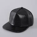 Detailed macro shot of the textured faux leather and stitching on the black snapback cap - Plain Style / Plain Black