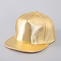 Close-up of golden PU leather snapback hat with metallic snake pattern texture - Plain Style / Plain Gold