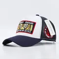 Navy and white trucker cap featuring detailed tiger embroidery and breathable mesh side - Tiger Eyes White Navy Brim