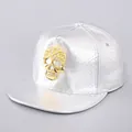 Detailed view of silver faux-snake texture cap with 3D gold skull and stud detailing - Silver Skull