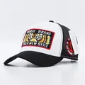 Trucker hat with tiger eye embroidery and mesh back in black and white finish - Tiger Eyes White Black Brim