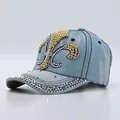 Light blue denim baseball cap with fleur-de-lis rhinestone pattern and studded brim - Fleur-de-lis Light Blue