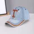 Light blue denim baseball cap featuring orange rhinestone letter T and silver crystal accents - Letter T Light Blue