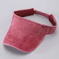 Detail view of cotton denim sun visor with adjustable strap and stitching details - Burgundy
