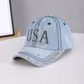 Light blue denim baseball cap featuring USA rhinestone lettering and metallic stud accents - USA Light Blue