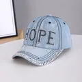 Light blue denim baseball cap with HOPE rhinestone lettering and silver studs on brim - HOPE Light Blue