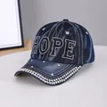 Dark blue denim baseball cap featuring sparkly rhinestone HOPE letters and white stitching - HOPE Dark Blue