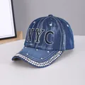 Navy blue denim baseball cap featuring sparkling rhinestone NYC letters and brim detailing - NYC Medium Blue