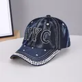Dark blue denim baseball cap featuring NYC rhinestone letters and studded brim decoration - NYC Dark Blue