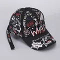 Detail of black cotton baseball cap featuring street style graffiti and long embroidered strap - Black WHAT (Ribbon)
