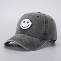 Close-up of charcoal wash cotton baseball cap featuring a white smiley face patch embroidery - Adjustable (Adult) / Black Smiley Face