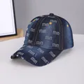 Dark blue washed denim baseball cap with colorful rhinestone letter pattern and frayed brim - Logo Dark Blue