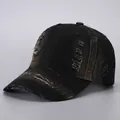 Detailed view of the distressed texture and ripped fabric on a vintage black baseball cap - Adjustable / Black Distressed Denim