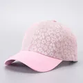 Detail of floral lace baseball cap showing delicate pink floral embroidery and brim - Pink Small Floral