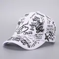 Detail of white cotton baseball cap with black graffiti print and various slogans - White Black-B52