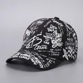 Streetwear black baseball cap with white graffiti slogans and hip hop urban design - Black White-B52