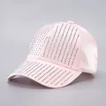 Detail of pink satin baseball cap with sparkling silver rhinestone tassels and curved brim - Adjustable / Pink