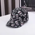Halloween baseball cap with skull print in black canvas from a 45-degree angle view - Adjustable / Black Skull