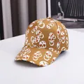 Halloween baseball cap in tan with all-over skull print and curved brim style - Adjustable / Yellow Skull