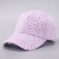Close-up of lavender lace baseball cap with sparkling rhinestones and floral pattern - Adjustable / Light Purple
