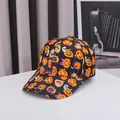 Halloween baseball cap with festive pumpkin and ghost prints on black curved brim hat - Adjustable / Pumpkin Print