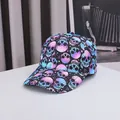 Halloween baseball cap featuring colorful gradient skull prints on a black curved brim hat - Adjustable / Colorful Skull