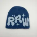 Detailed view of the fuzzy faux mink fabric texture on the blue RRW knitted beanie - One Size / Blue