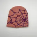 Detail of pink fuzzy knit beanie featuring purple spider web pattern and plush texture - One Size / Pink Spider Web