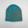Detailed close-up showing the soft turquoise plush knit texture and orange spider web pattern - One Size / Light Blue Spider Web