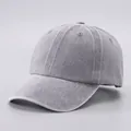 Detailed macro view showing the washed cotton fabric texture and eyelets of the baseball cap - Adjustable / Pure Cotton Soft Top - Light Gray