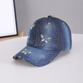 Distressed dark blue denim baseball cap with rhinestone butterfly patterns and frayed brim - Butterfly Medium Blue