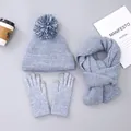 Detailed knit texture of blue-grey winter hat, scarf, and touchscreen gloves set - Hat with Pom-poms / Light Blue