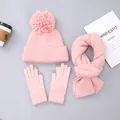 Detailed flat lay of pink knit hat with pompom, scarf, and touchscreen gloves set - Hat with Pom-poms / Pink