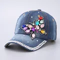 Deep blue denim baseball cap with a colorful rhinestone butterfly and crystal accents - Denim Blue Side Butterfly