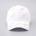 Macro detail of silver rhinestones forming Love patterns on white baseball cap - Adjustable / White - Small Rhinestone LOVE