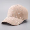 Detailed texture of khaki corduroy baseball cap with scattered metal letter charms - Khaki - Full Rhinestone Hot Stamping Letters