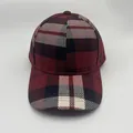 Close-up of British style red plaid baseball cap featuring classic check pattern fabric - Adjustable / Red and White Houndstooth