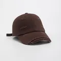 Detail view of dark brown twill cotton baseball cap with vintage distressed torn edges - Coffee