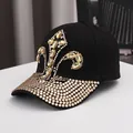 Black cotton baseball cap featuring ornate gold rhinestones and crystal crown design - Adjustable / Black