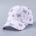 Detailed view of white lace baseball cap featuring elegant purple butterfly prints - Adjustable / Plain Lace Purple Butterfly