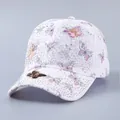 Close-up of white lace baseball cap featuring 3D butterfly decor and sparkling rhinestones - Adjustable / Rhinestone 3D Pink Butterfly