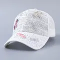 Detailed view of white lace baseball cap featuring 3D dragonflies and sparkly rhinestones - Adjustable / Rhinestone 3D Dragonfly Beige