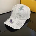 White baseball cap with colorful dragonfly rhinestone patterns and sparkling accents - Adjustable / 3D Dragonfly - White