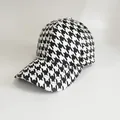 Close-up of classic black and white houndstooth pattern on a 6-panel baseball cap - Adjustable / Autumn Houndstooth-White