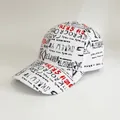Close-up of graffiti-style letter prints on white cotton baseball cap with wide brim - Adjustable / White Small Letter Printing
