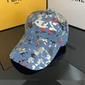 Blue denim baseball cap with gold and red graffiti camouflage pattern on dark surface - Adjustable / Bronzing Camouflage - Light Blue