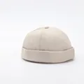 Detail view of a beige brimless docker hat showing 6-panel stitch and cotton twill texture - Adjustable / Beige