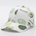 Detail of white cotton baseball cap with green avocado print and Avocado text - Adjustable / Avocado 3 (White Base)