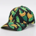 Detail of tropical banana print and leaf pattern on black canvas baseball cap fabric - Adjustable / Banana 1 (Black Base)