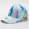 Detail of a curved brim baseball cap with blue and pink abstract digital art prints - Adjustable / Modern Abstract Art (16#)